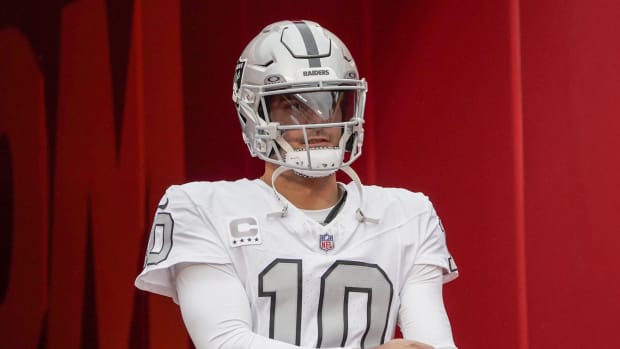 Dec 25, 2023; Kansas City, Missouri, USA; Las Vegas Raiders quarterback Jimmy Garoppolo (10) walks on the field against the Kansas City Chiefs prior to a game at GEHA Field at Arrowhead Stadium.